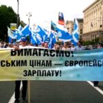 Protests marched under the banner "European wages to pay European prices!"