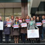 Members of the Federation of Trade Unions of Communications Workers of Moldova with a solidarity sign