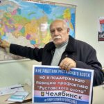 Members of the Miners' & Metallurgical Workers' Union of Russia with a solidarity sign