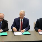 Reinhard Müller, chairman EWC; Peter Sebastian Krause, Senior Executive Officer, Labor Relations & Human Resources; and Valter Sanches, general secretary IndustriALL, sign the GFA on 12 October 2018