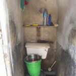 The shower is nothing more than a bucket in a toilet cubicle for this Shell contract worker.