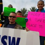 USW oil workers and their families took to the streets on Sunday as the strike started.  Source: USW
