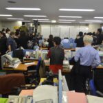 The JCM office is packed with members of the media